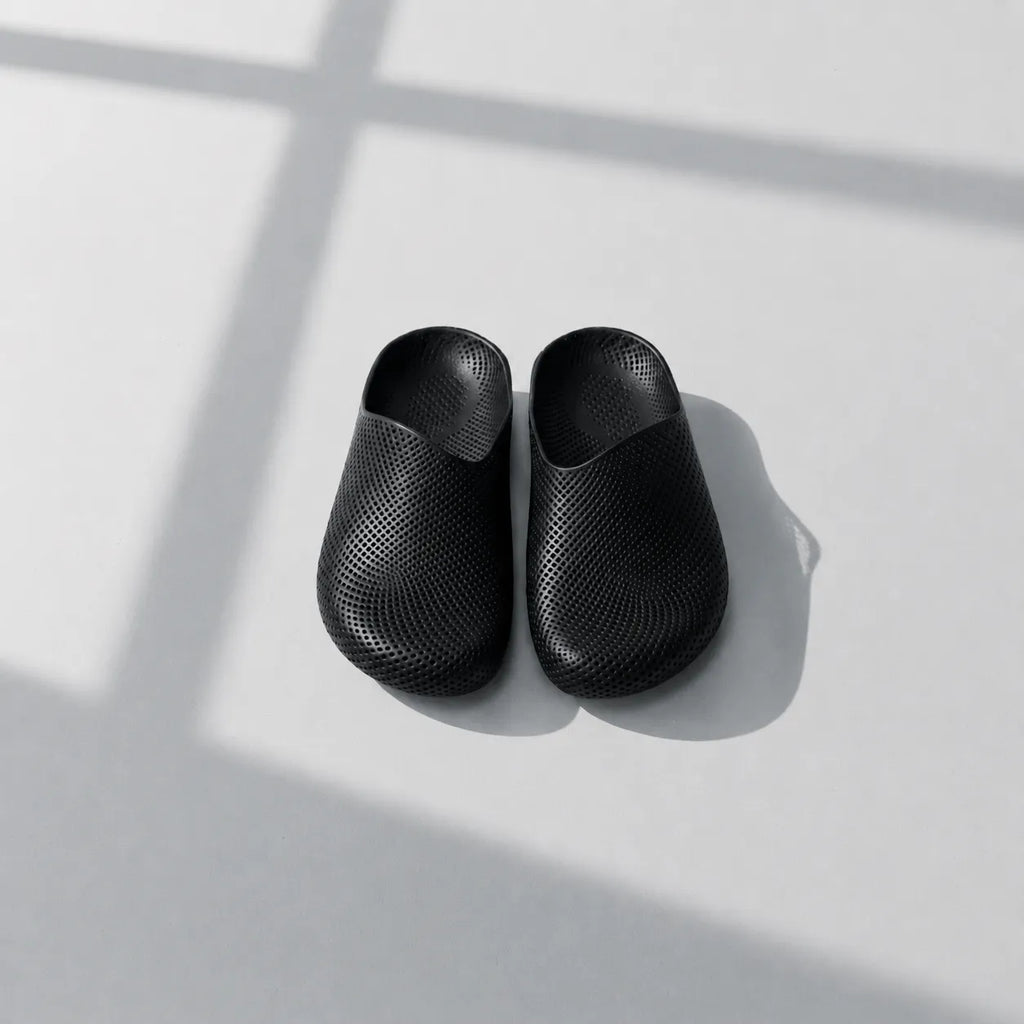 EASE 01 3D printed house slipper —  showing fine mesh lattice upper and minimal sole