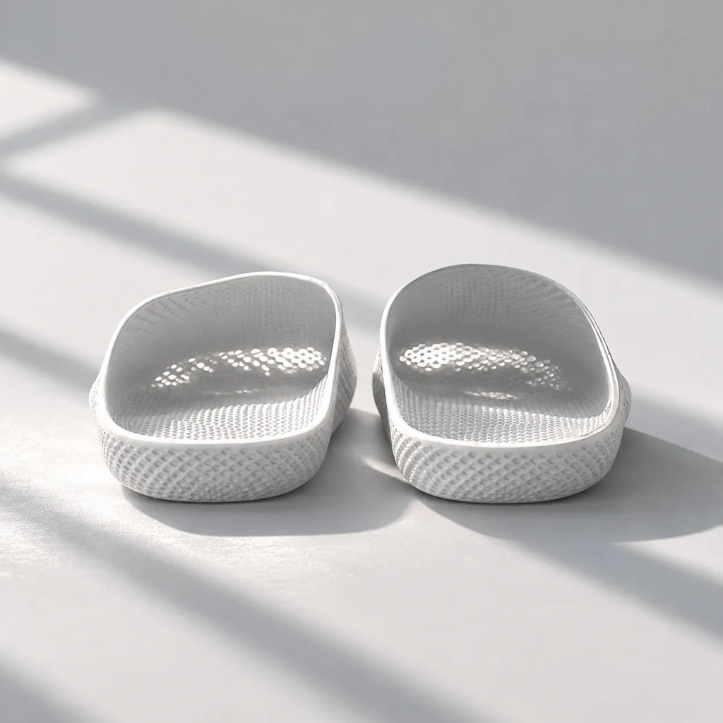 EASE 01 3D printed house slipper —  showing fine mesh lattice upper and minimal sole