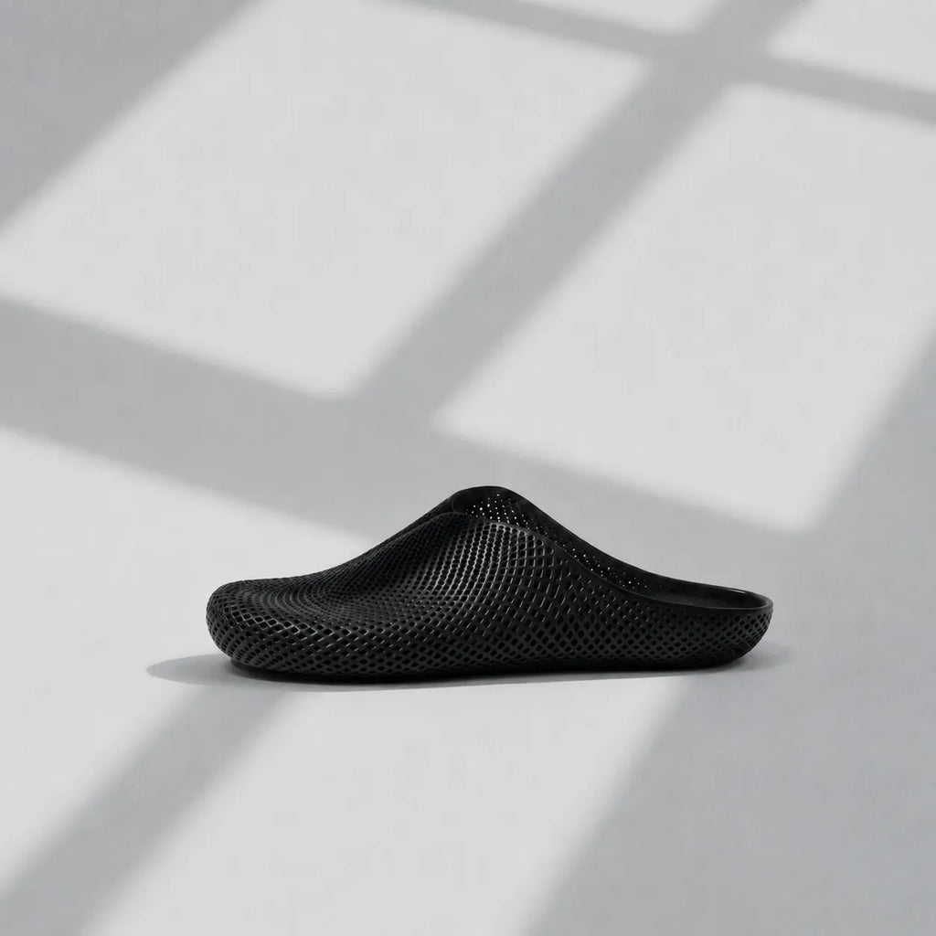 EASE 01 3D printed house slipper —  showing fine mesh lattice upper and minimal sole