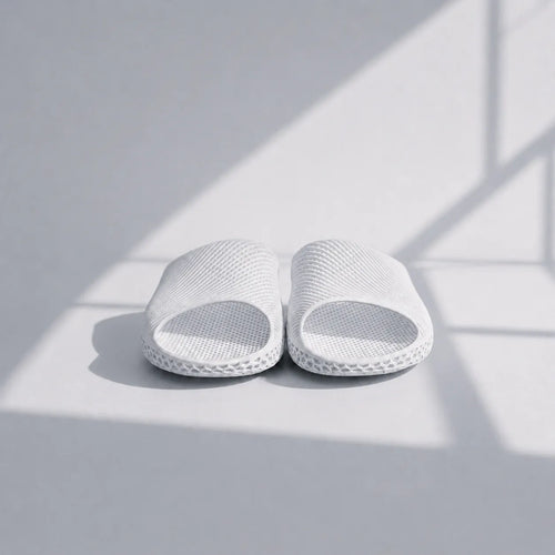 EASE 02 3D printed slide sandal — wave-textured upper and open honeycomb lattice sole