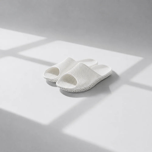 EASE 02 3D printed slide sandal — wave-textured upper and open honeycomb lattice sole