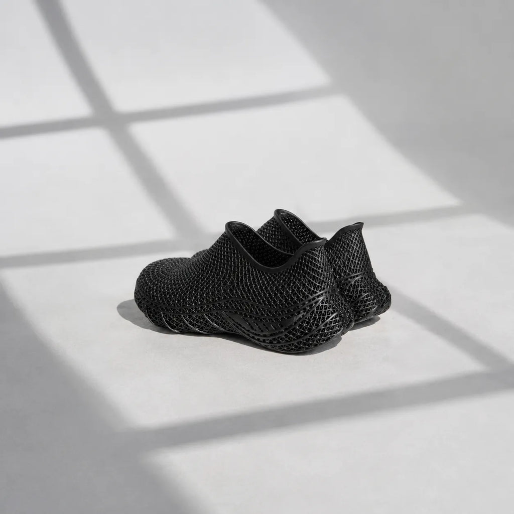 EXTRALOGIA FORM02 3D printed shoe pair — showing triangulated open-lattice structure